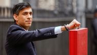 Britain's Chancellor of the Exchequer Rishi Sunak holds the budget box outside Downing Street in London, Britain, March 3, 2021. REUTERS/John Sibley