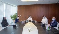 Turki bin Mohammed Al Khater, Ibrahim Jassim Al Othman, and other officials of UDC during the Ordinary General Assembly meeting.