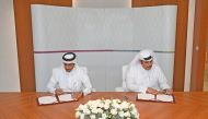 President of GTA, Ahmed bin Issa Al Mohannadi, and Head of QFIU, Sheikh Ahmed bin Eid Al Thani, signing the MoU.