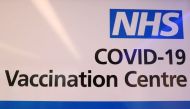 FILE PHOTO: An NHS sign is displayed at the coronavirus disease (COVID-19) vaccination centre at Cliffs Pavilion in Southend-on-Sea, Britain, February 4, 2021. REUTERS/Paul Childs
