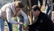 Syria's President Bashar al-Assad and his wife Asma, plant trees in city of Draykish, near Tartous, Syria December 30, 2020. Picture taken December 30, 2020. 