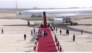 Pope Francis is accompanied by Iraqi President Barham Salih and his wife Sarbagh Salih during the Pope's farewell ceremony before departing for Rome, at Baghdad International Airport in Baghdad, Iraq, March 8, 2021