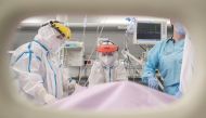 Doctor Tatjana Peric treats a patient suffering from the coronavirus disease (COVID-19) on International Women's Day at the intensive care unit of the Clinical Center of Vojvodina in Novi Sad, Serbia, March 8, 2021. REUTERS/Marko Djurica

