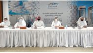 Salah bin Ghanem Al Ali, Chairman of Board of Directors, and other officials during Ordinary General Assembly Meeting of Barwa Real Estate Company held yesterday.