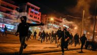 Protesters run during a demonstration against a police crackdown on gatherings, in Athens, Greece, March 9, 2021. REUTERS/Alkis Konstantinidis
