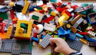 File photo: Sirio Persichetti, a 7-year-old Italian with spastic tetraplegia and cerebral palsy who has become an influencer by challenging perceptions of disability, builds a house out of lego, in Rome, Italy, October 20, 2020. Reuters/Yara Nardi/File Ph