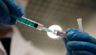 FILE PHOTO: A medical worker holds a syringe with Sputnik V vaccine against the coronavirus disease (COVID-19) at a vaccination centre in Saint Petersburg, Russia February 24, 2021. REUTERS/Anton Vaganov/File Photo
