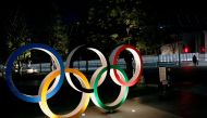 The Olympic rings are illuminated in front of the National Stadium in Tokyo, Japan January 22, 2021. REUTERS/Kim Kyung-Hoon//File Photo