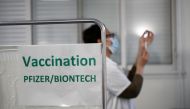 FILE PHOTO: A healthcare worker draws a dose of the Pfizer-BioNTech COVID-19 vaccine at the Clinique de l'Estree - ELSAN private hospital in Stains as part of the coronavirus disease (COVID-19) vaccination campaign in France, March 5, 2021. REUTERS/Benoit