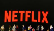 FILE PHOTO: Small toy figures are seen in front of diplayed Netflix logo in this illustration taken March 19, 2020. REUTERS/Dado Ruvic/Illustration/File Photo
