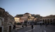 People make their way on Monastiraki square, amid the coronavirus disease (COVID-19) pandemic, in Athens, Greece, March 10, 2021. Picture taken March 10, 2021. REUTERS/Louiza Vradi