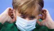 German Chancellor Angela merkel adjusts her face mask after a news conference following the 13. Integration Summit at the chancellery in Berlin, Germany March 9, 2021. Markus Schreiber/Pool via REUTERS
