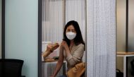 A health worker gets a dose of the Pfizer-BioNTech coronavirus disease (COVID-19) vaccine at a COVID-19 vaccination center in Seoul, South Korea, March 10, 2021. REUTERS/Kim Hong-Ji