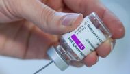 A medical worker prepares a dose of AstraZeneca's COVID-19 vaccine amid a vaccination campaign in Ronquieres, Belgium March 15, 2021. REUTERS/Yves Herman