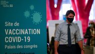 Canada's Prime Minister Justin Trudeau visits a vaccination clinic at the Palais des Congres, as efforts continue to help slow the spread of the coronavirus disease (COVID-19), in Montreal, Quebec, Canada March 15, 2021. REUTERS/Andrej Ivanov
