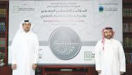 Chairman of the Organizing Committee and Vice-Chairman of Bait Al Mashoura Finance Consultations Company, Prof. Dr. Khalid bin Ibrahim Al Sulaiti, with Chief Marketing and Communications Officer at Dukhan Bank, Talal Al Khajah.