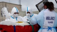 A medical crew from Angers hospital carries a patient suffering from the coronavirus disease (COVID-19) on a stretcher after his transfer by a helicopter of French SAMU rescue team, from the Ile de France region to Angers hospital, France, March 15, 2021.