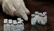 FILE PHOTO: A health worker counts used vials of Sinopharm's coronavirus disease (COVID-19) vaccine, at a vaccination centre in Karachi, Pakistan February 11, 2021. REUTERS/Akhtar Soomro/File Photo
