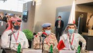 Major General Mohammad bin Abdul Latif Al Mannai (centre), Advisor to the Deputy Prime Minister and Minister of State for Defense and Security Affairs and Chairman of the Ministry of Defense Executive Committee for 2022 World Cup with Abdullah Hassan Al K