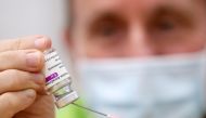 A medical worker prepares a dose of Oxford/AstraZeneca's COVID-19 vaccine at a vaccination centre in Antwerp, Belgium March 18, 2021. REUTERS/Yves Herman
