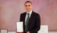 German scientist, CEO and co-founder of BioNTech, Ugur Sahin poses with the Bundesverdienstkreuz (Federal Cross of Merit) awarded to him by German President Frank-Walter Steinmeier, at the presidential Bellevue Palace in Berlin, Germany March 19, 2021 Odd