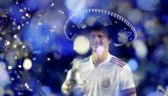March 20, 2021 Germany's Alexander Zverev celebrates with the trophy after winning the Mexican Open REUTERS/Carlos Perez-Gallardo 