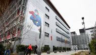 People wearing protective face masks are seen outside the Papa Giovanni XXIII hospital a year after the peak of Italy's coronavirus disease (COVID-19) outbreak, in Bergamo, the country's epicentre, Italy, March 3, 2021. Picture taken March 3, 2021. REUTER