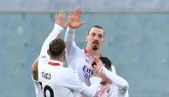 Soccer Football - Serie A - Fiorentina v AC Milan - Stadio Artemio Franchi, Florence, Italy - March 21, 2021 AC Milan's Zlatan Ibrahimovic celebrates scoring their first goal with Theo Hernandez REUTERS/Jennifer Lorenzini
