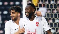 Al Rayyan's Yohan Boli is congratulated by team-mate Ibrahim Abdelhalim Masoud after the Ivorian scored a goal against Al Gharafa during yesterday's Ooredoo Cup semi-final.
