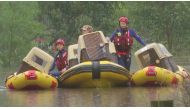 Dogs in carriers are transported on inflatable boats by State Emergency Service personnel during a rescue amid rising floodwaters in Sydney, Australia, March 22, 2021, in this still image taken from video provided by Reuters TV. REUTERS/via REUTERS TV
