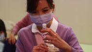 A nurse prepares a dose of the AstraZeneca vaccine against the coronavirus disease (COVID-19) during a vaccination for medical workers in Taipei, Taiwan, March 22, 2021. REUTERS/Ann Wang