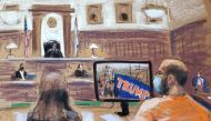 George Pierre Tanios watches as a video of the January 6th storming of the U.S. Capitol in Washington is shown during his hearing on charges of pepper-spraying Capitol police officers, in Clarksburg, West Virginia, U.S. March 22, 2021, in this courtroom s
