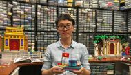 Hoang Dang, an industrial designer who loves Lego since he was a child poses in front of his pieces at his home in Hanoi, Vietnam March 13, 2021. Picture taken March 13, 2021. REUTERS/Minh Nguyen
