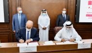 Officials of Qatar Chamber and Tunisian Union of Industry and Commerce during the signing of the agreement.
