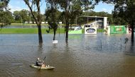 A local resident kayaks through floodwaters in front of the Windsor Leagues Club in the suburb of South Windsor as the state of New South Wales experiences widespread flooding and severe weather, near Sydney, Australia, March 24, 2021. REUTERS/Jaimi Joy