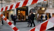 People walk down a shopping street, as the local Government discusses to close non-essential shops for several days over Easter due to the coronavirus disease (COVID-19) outbreak, in Vienna, Austria March 24, 2020. REUTERS/Leonhard Foeger
