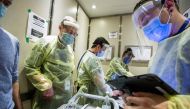 Nurses and doctors from Humber River Hospital ride an elevator as they prepare to administer the Moderna coronavirus disease (COVID-19) vaccine at a Toronto Community Housing seniors building in the northwest end of Toronto, Ontario, Canada March 25, 2021