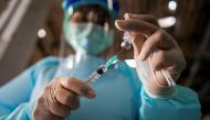 FILE PHOTO: A health worker prepares to administer the Sinovac coronavirus disease (COVID-19) vaccine at a market after hundreds of local residents in the district tested positive for COVID-19 in Bangkok, Thailand, March 17, 2021. REUTERS/Athit Perawongme