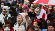 FILE PHOTO: Belarusian opposition supporters attend a rally to protest against the results of a presidential election and urge President Alexander Lukashenko to step down in Minsk, Belarus November 2, 2020. REUTERS