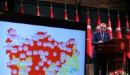 Turkish President Tayyip Erdogan gives a statement after a cabinet meeting in Ankara, Turkey, March 29, 2021. Murat Cetinmuhurdar/PPO/Handout via REUTERS