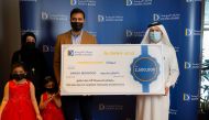 Braik Al Marri, Chief Retail Banking Officer at Doha Bank presenting the QR2.5m grand prize to D. Mehmood. 
