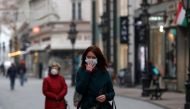 FILE PHOTO: People wearing protective face masks walk in downtown Budapest, after Hungarian government imposed a nationwide lockdown to contain the spread of the coronavirus disease (COVID-19), Hungary, November 11, 2020. REUTERS/Bernadett Szabo/Files/Fil