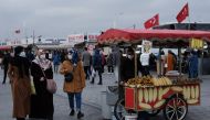 FILE PHOTO: People wearing protective masks stroll at Eminonu district amid the coronavirus disease (COVID-19) outbreak, in Istanbul,... MURAD SEZER March 26, 2021 11:46am EDT
