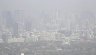 This aerial image taken from a Kyodo News helicopter shows the city of Osaka blanketed in a sandstorm, in this photo taken by Kyodo, Japan March 30, 2021. Kyodo/via Reuters