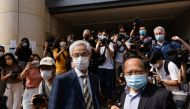 Democratic Party founder and barrister Martin Lee and Albert Ho arrive at the West Kowloon Courts for verdicts in landmark unlawful assembly case, in Hong Kong, China April 1, 2021. REUTERS/Tyrone Siu