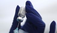 A healthcare worker prepares a Pfizer coronavirus disease (COVID-19) vaccination in Los Angeles, California, U.S., January 7, 2021. REUTERS/Lucy Nicholson/File Photo
