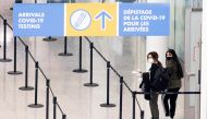 FILE PHOTO: Passengers arrive at Toronto's Pearson airport after mandatory coronavirus disease (COVID-19) testing took effect for international arrivals in Mississauga, Ontario, Canada February 1, 2021. REUTERS/Carlos Osorio/File Photo
