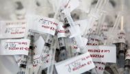 FILE PHOTO: Syringes with doses of Pfizer vaccine against the coronavirus disease (COVID-19) sit in a basket waiting to be administered at Richmond raceway in Richmond, Virginia, U.S., March 4, 2021. REUTERS/Julia Rendleman/File photo Reuters

