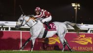 Ronan Thomas guides Tayf past the finish line in the feature of the day at Qatar Racing and Equestrian Club’s Al Rayyan Race Park. Tayf won Gr 1 P/A Qatar Gold Sword .