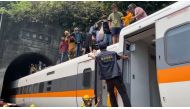 Rescue team help stranded passengers down from the roof of a train which derailed in a tunnel north of Hualien, Taiwan April 2, 2021, in this still image taken from video. FACEBOOK @HUALIENFASTNEWS via REUTERS 